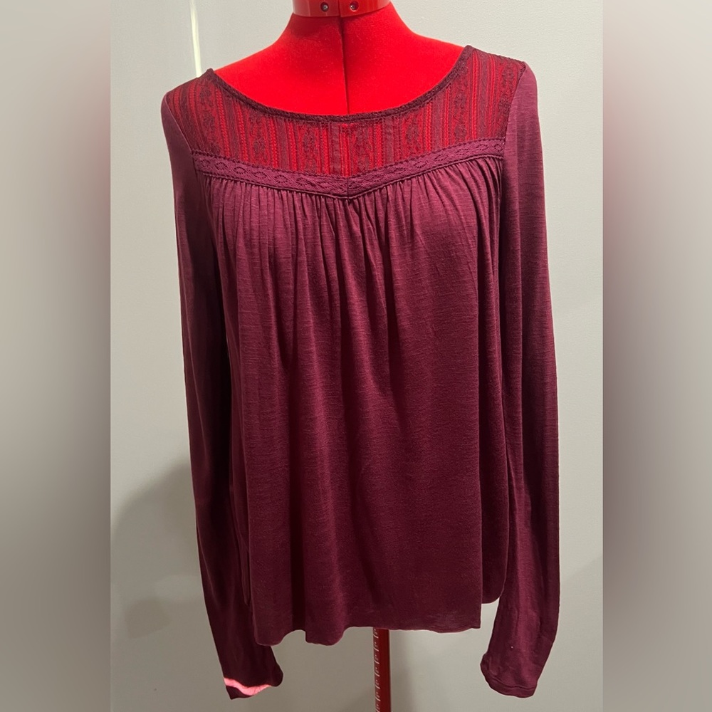 Fun burgundy top with cut out back